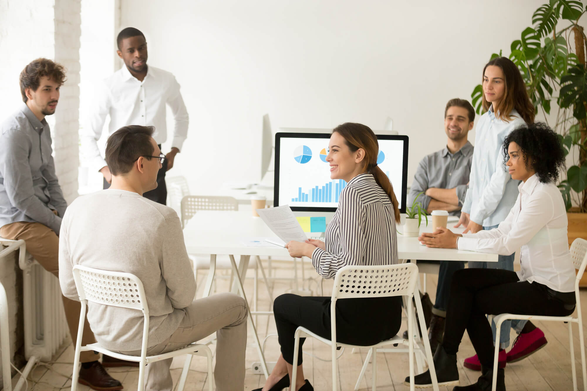 inclusive hiring tips featured image of diverse people sitting in office interview
